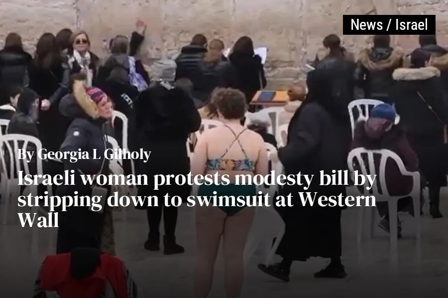 Israeli woman protests modesty bill by stripping down to swimsuit